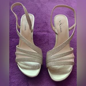 BRAND NEW-NEVER WORN-IN BOX   Light glittery gold/neutral color Size 8.5